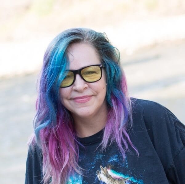 Find Your Weight Loss Zen Dixie Vogel, author of Weight Loss Zen, with colorful hair and glasses, smiling outdoors